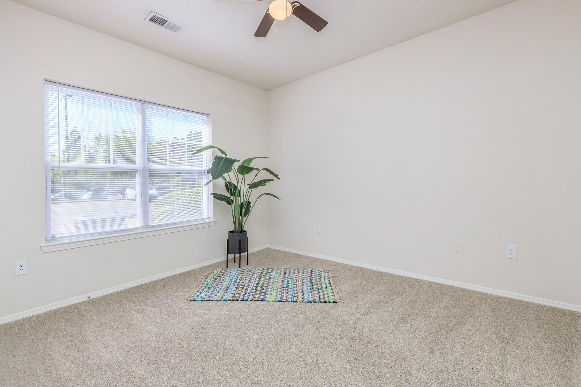 a living room next to a window