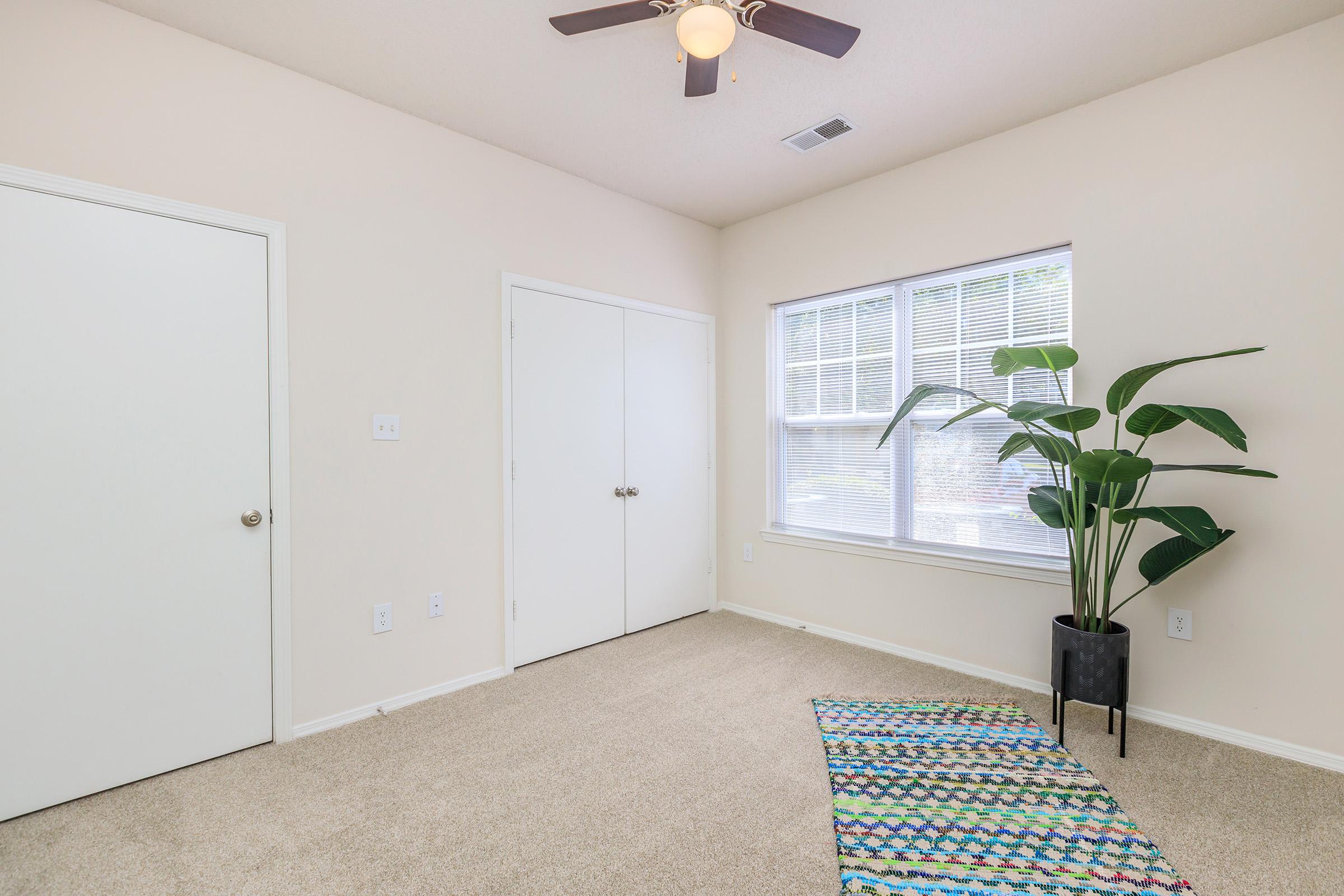 a room filled with furniture and a large window