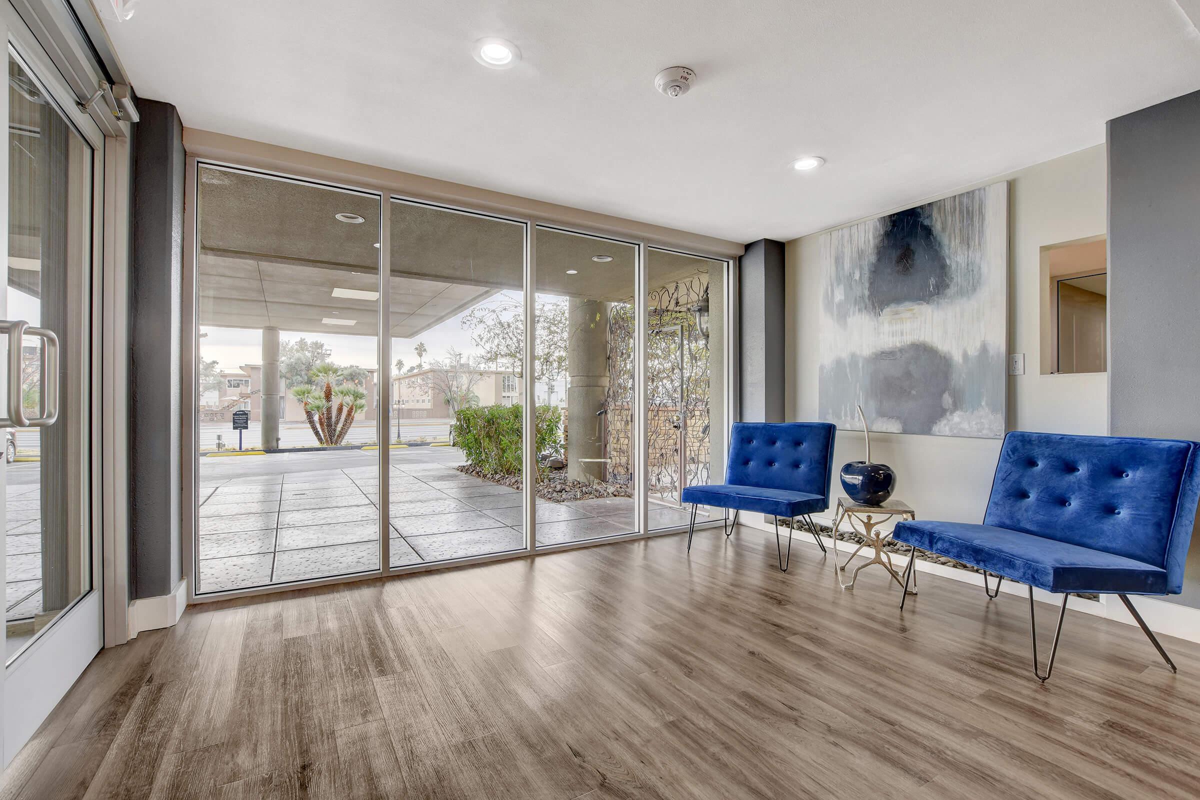 a room filled with furniture and a large window
