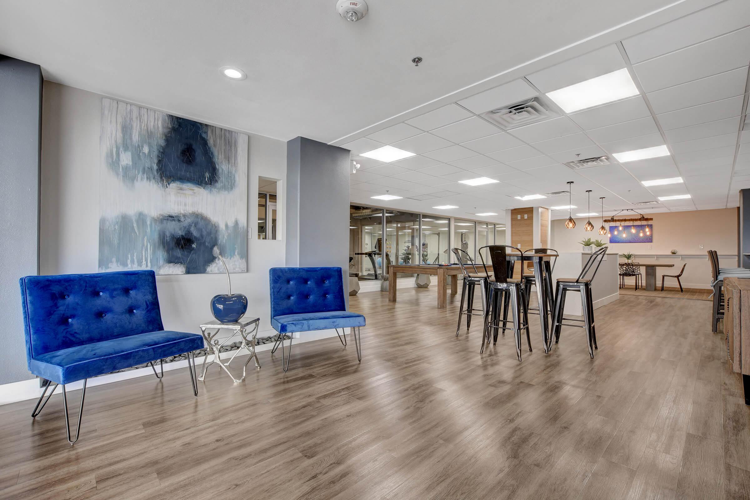 a room filled with furniture and a blue sky