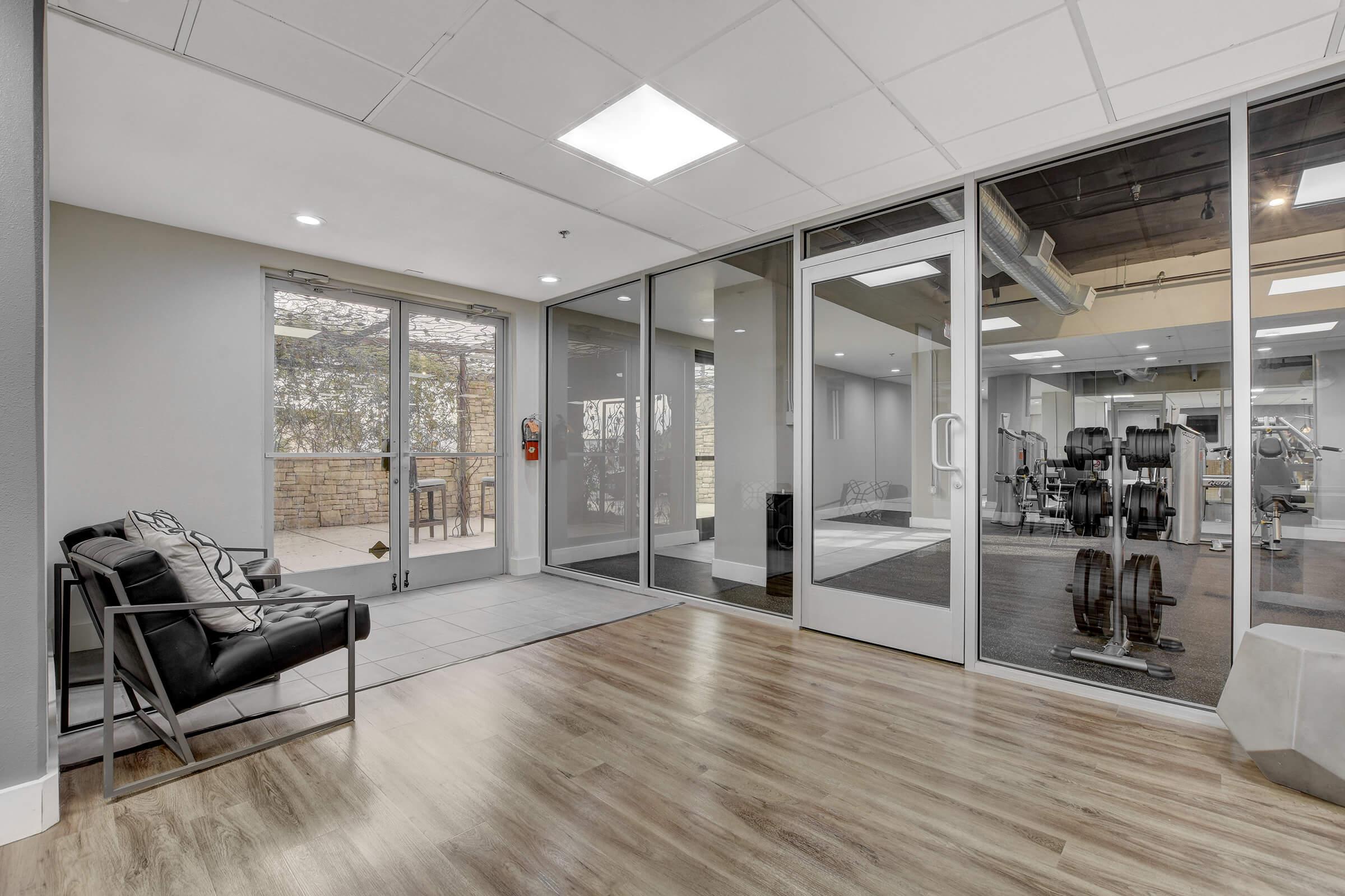 a room filled with furniture and a large window