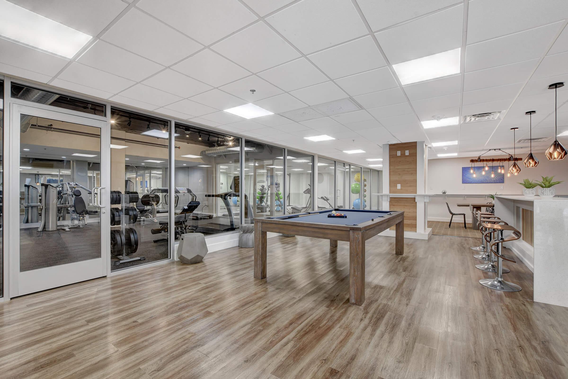 a room filled with furniture next to a building