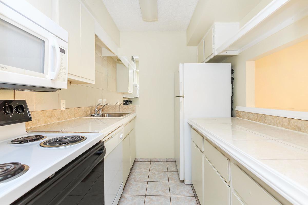 a kitchen with a stove top oven