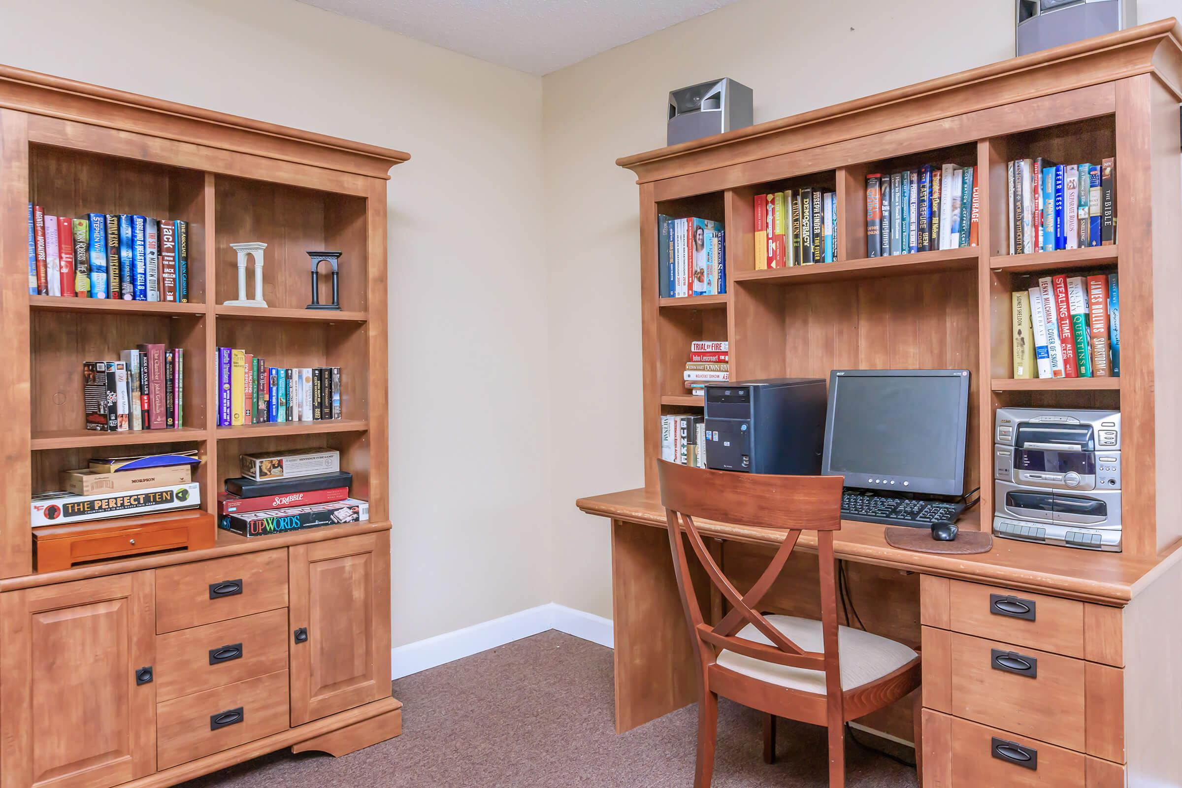 a living room with a book shelf