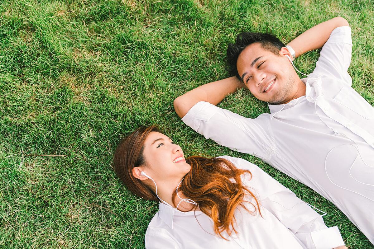a little girl lying in the grass