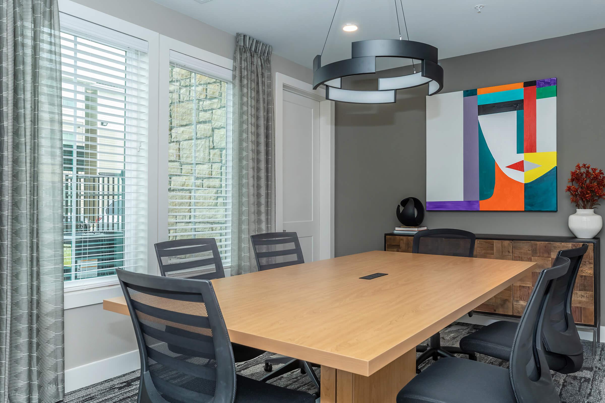 an office with a desk and chair in a room