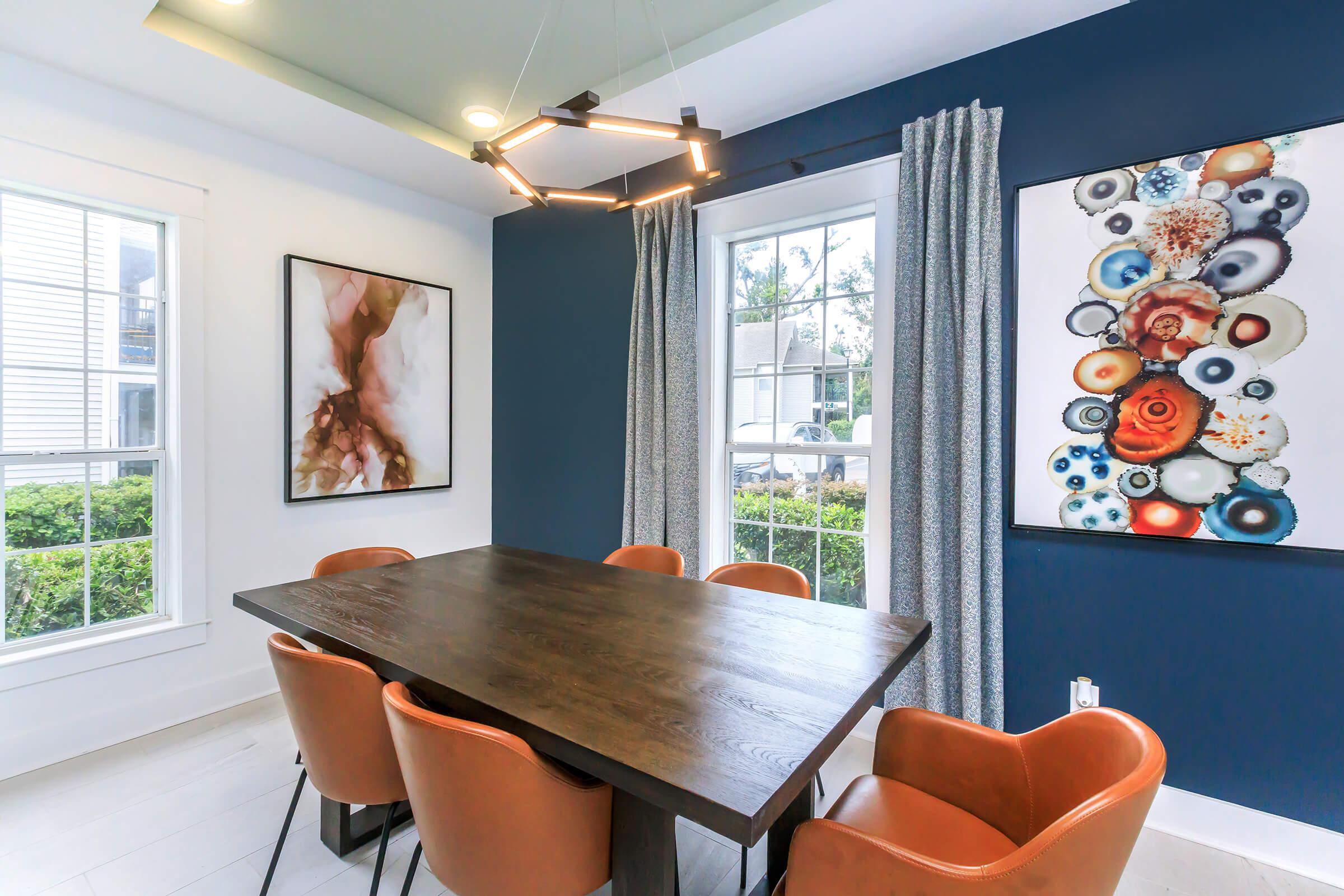 a dining room table in front of a window