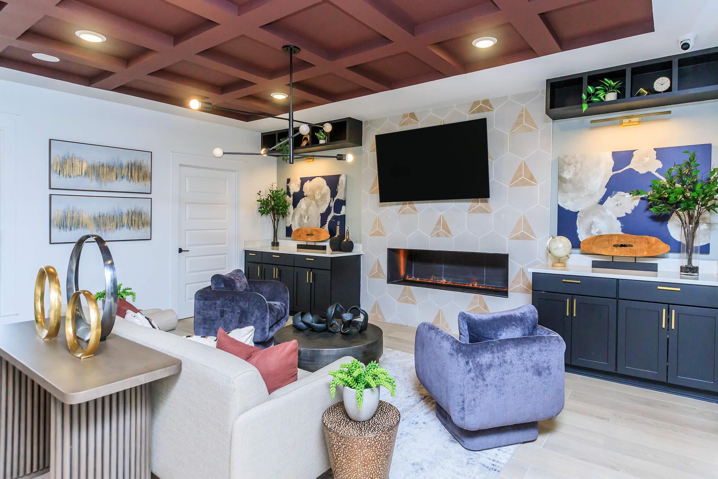 a living room filled with furniture and a fireplace