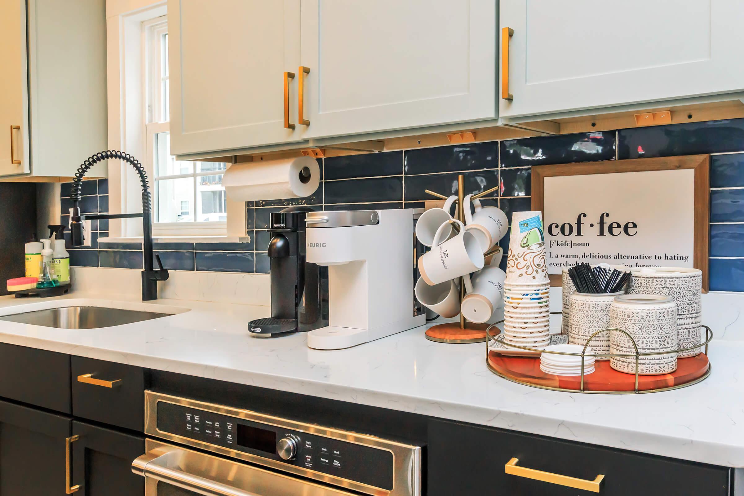 a stove top oven sitting inside of a kitchen