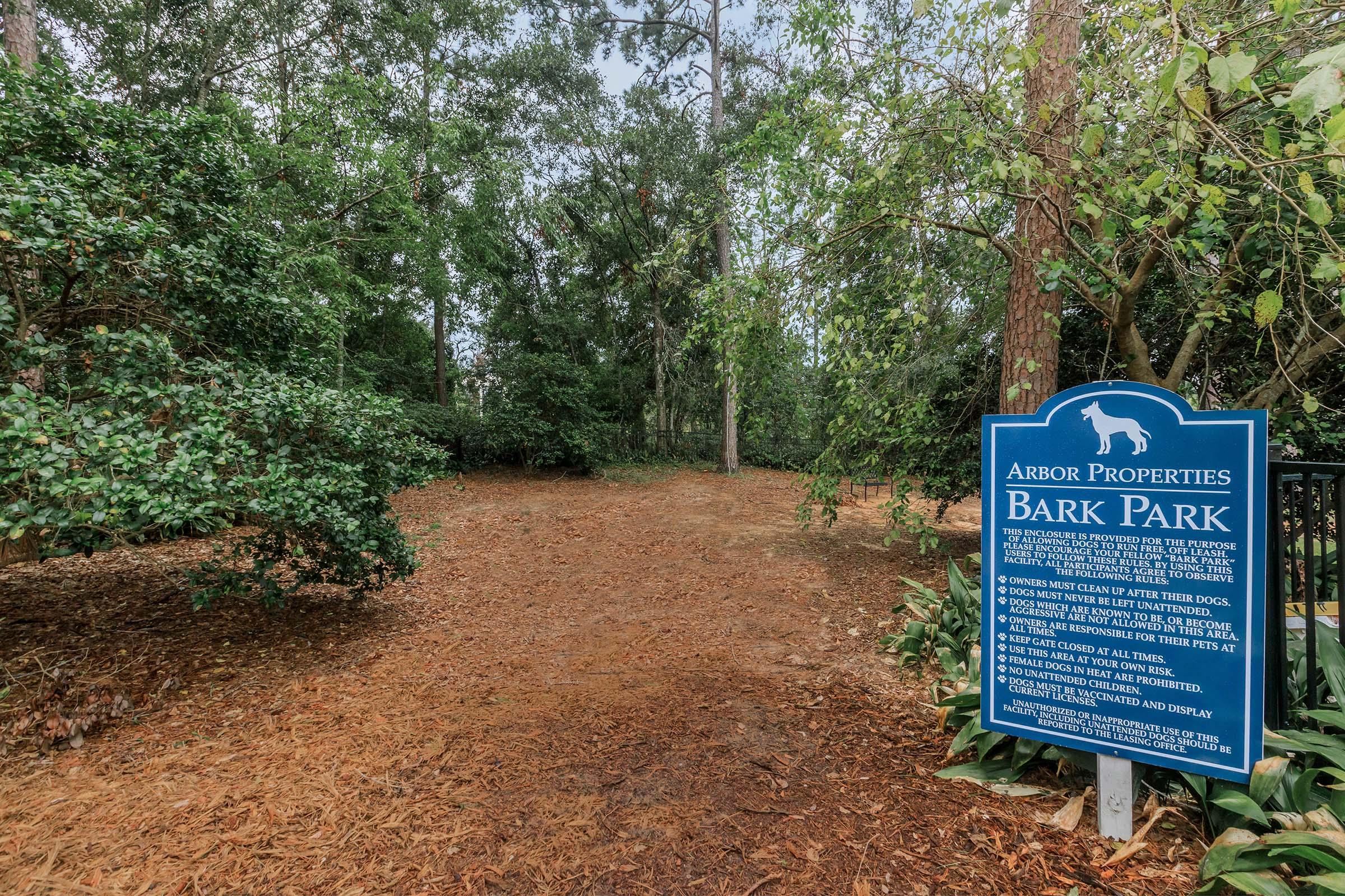 a sign on the side of a tree