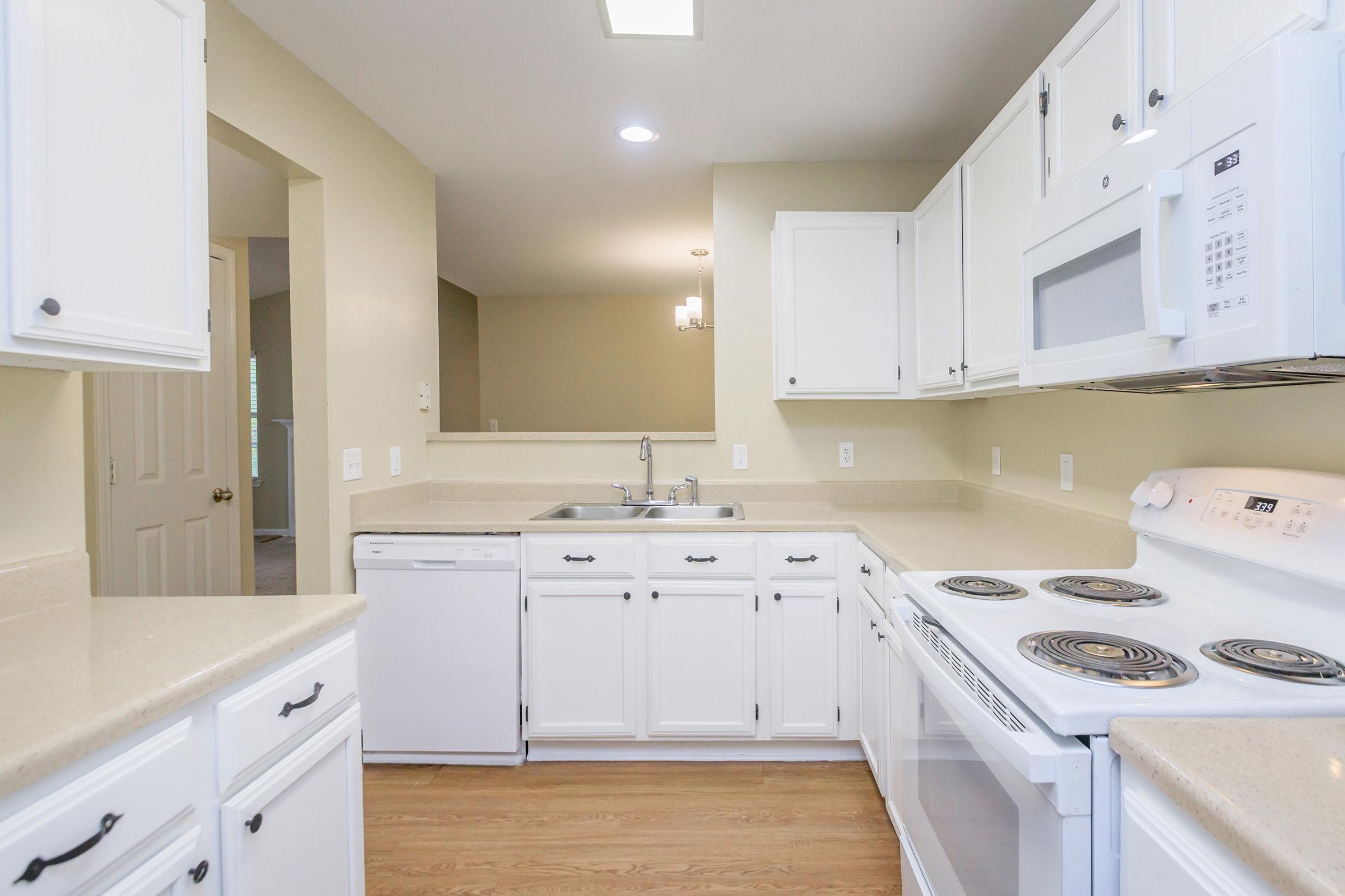 a kitchen with a stove top oven