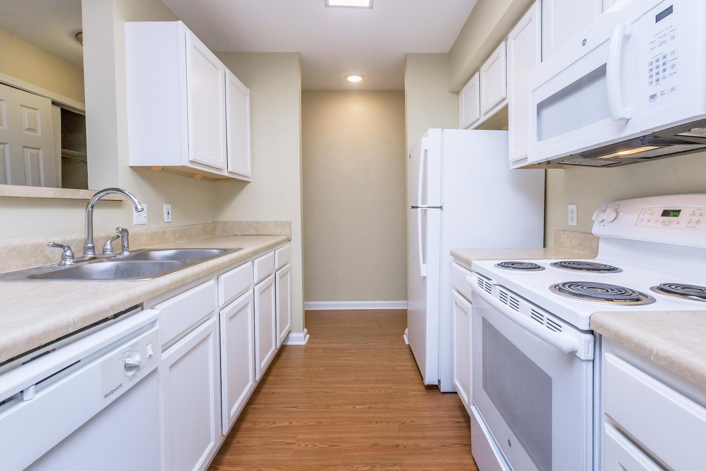 a kitchen with a stove top oven