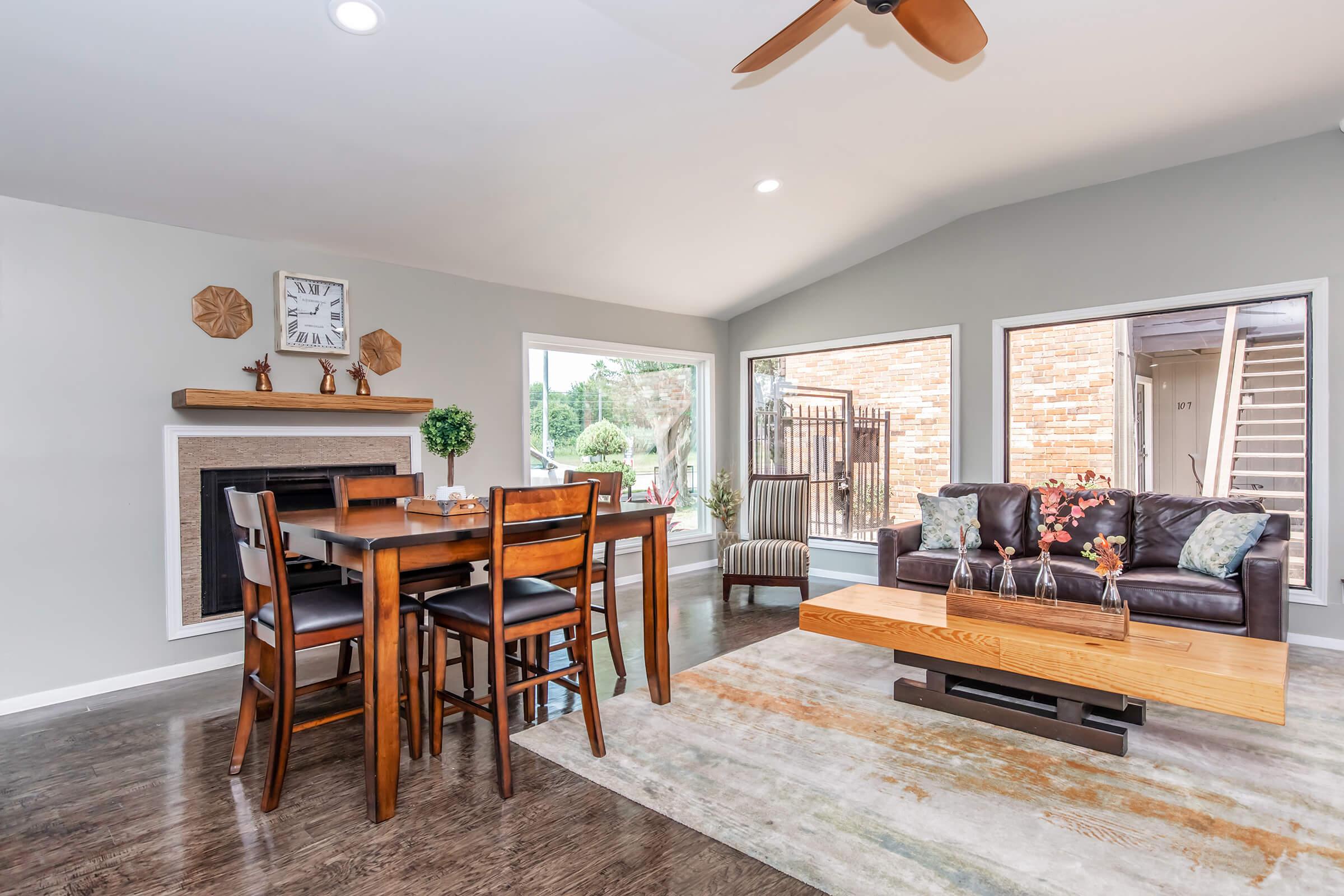 a living room filled with furniture and a fireplace