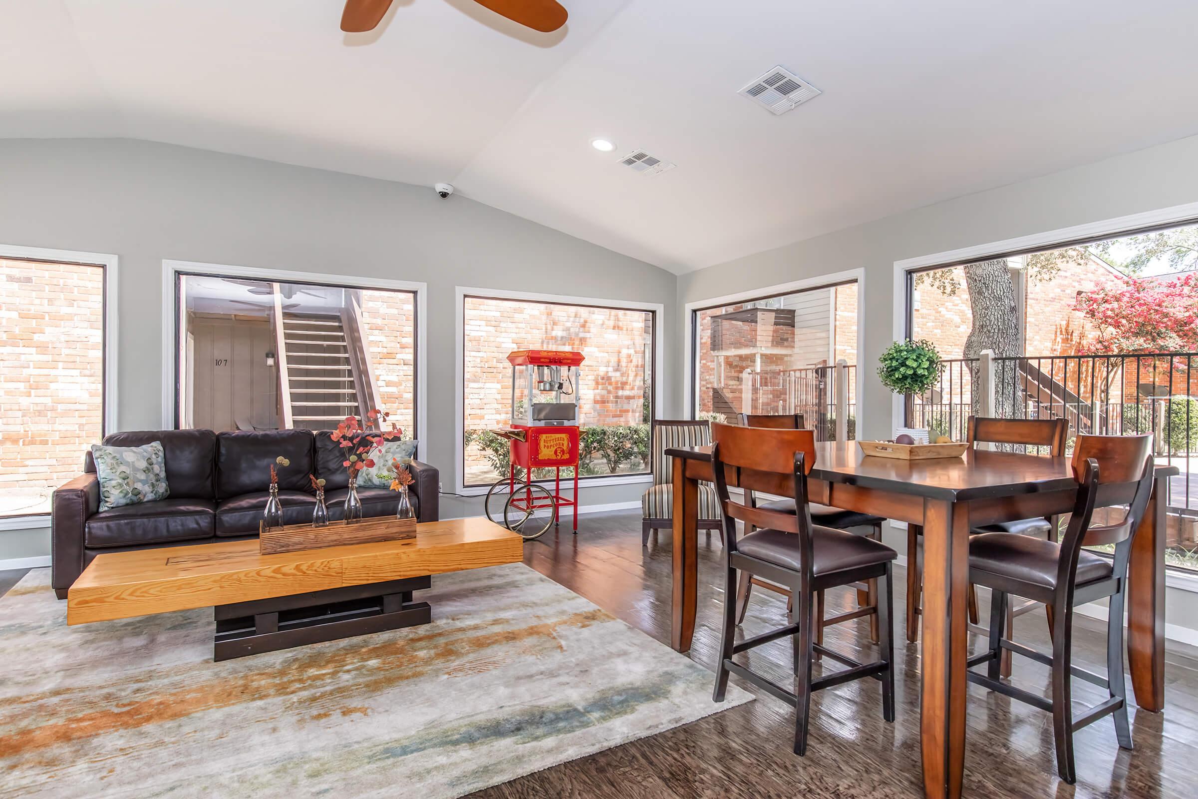 a living room filled with furniture and a fireplace