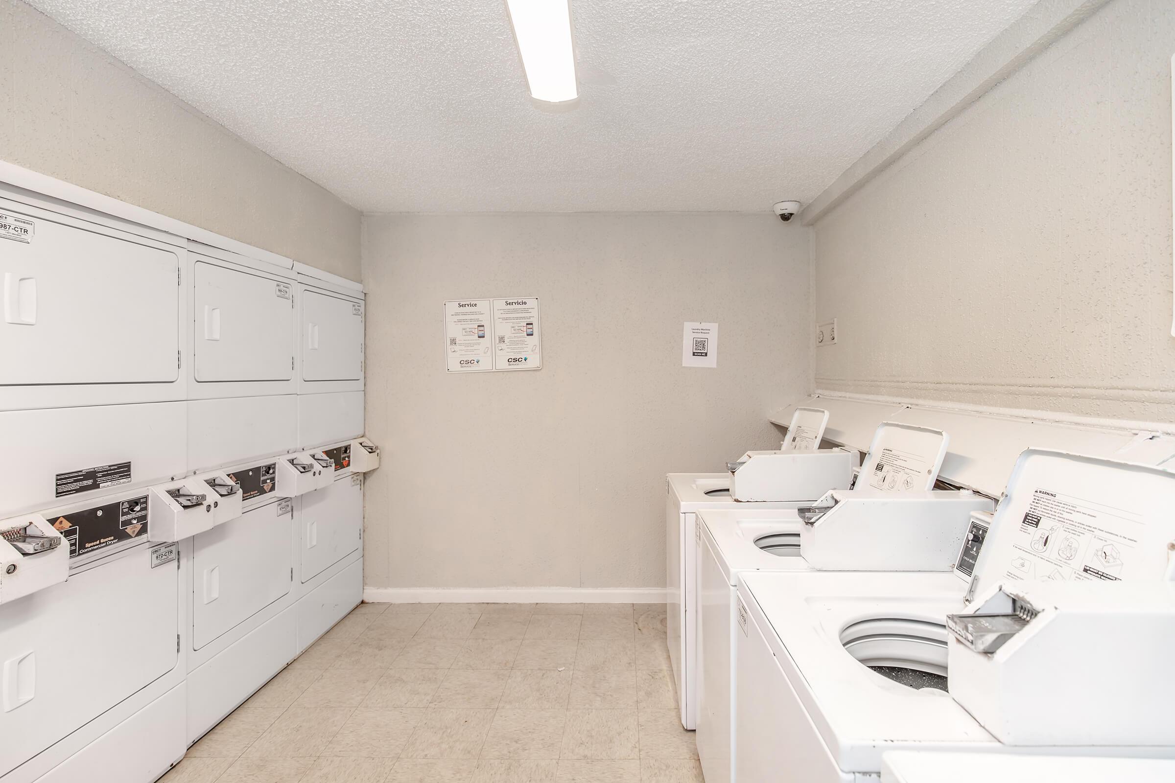 a kitchen with a stove top oven sitting inside of a room