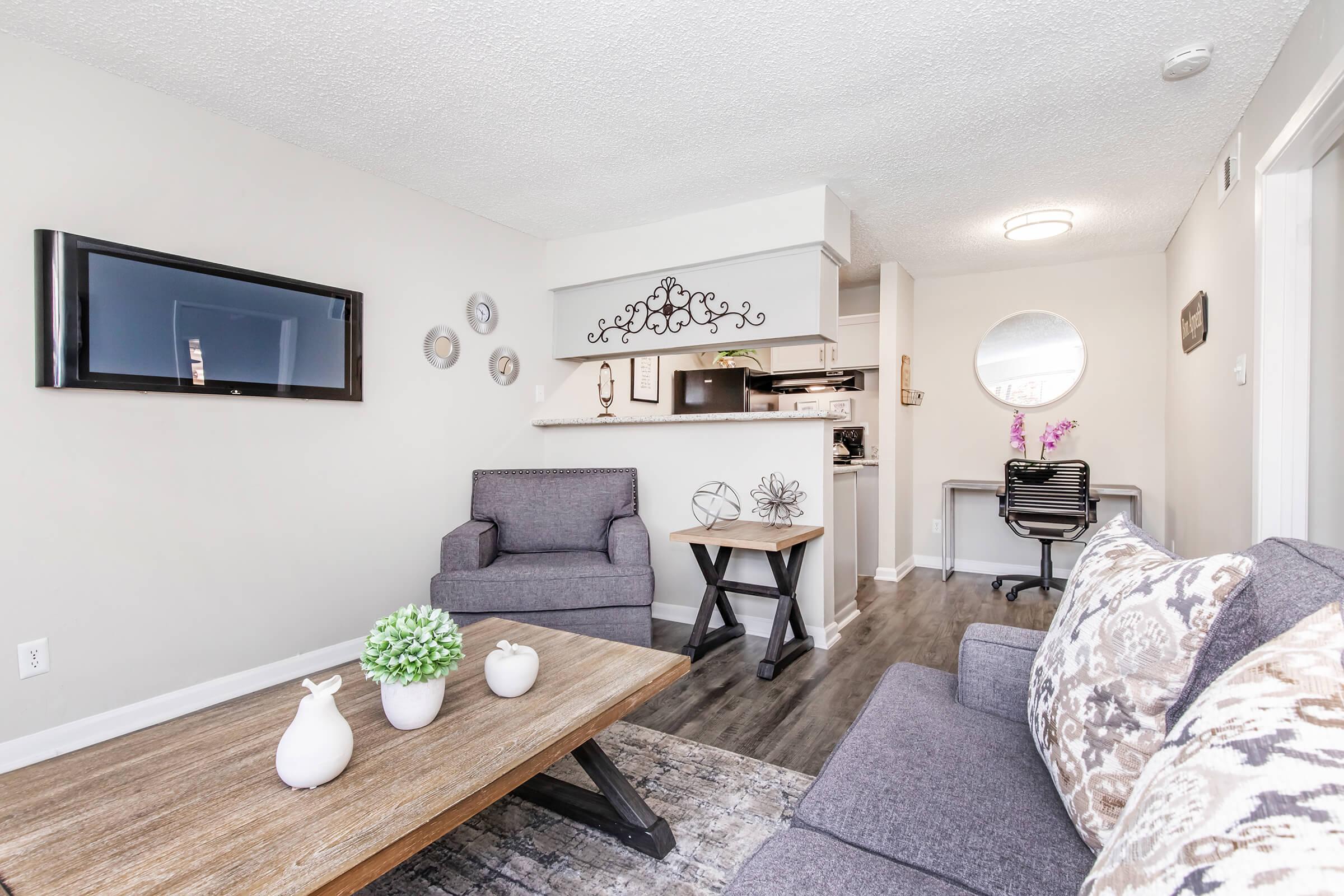 a living room filled with furniture and a fireplace