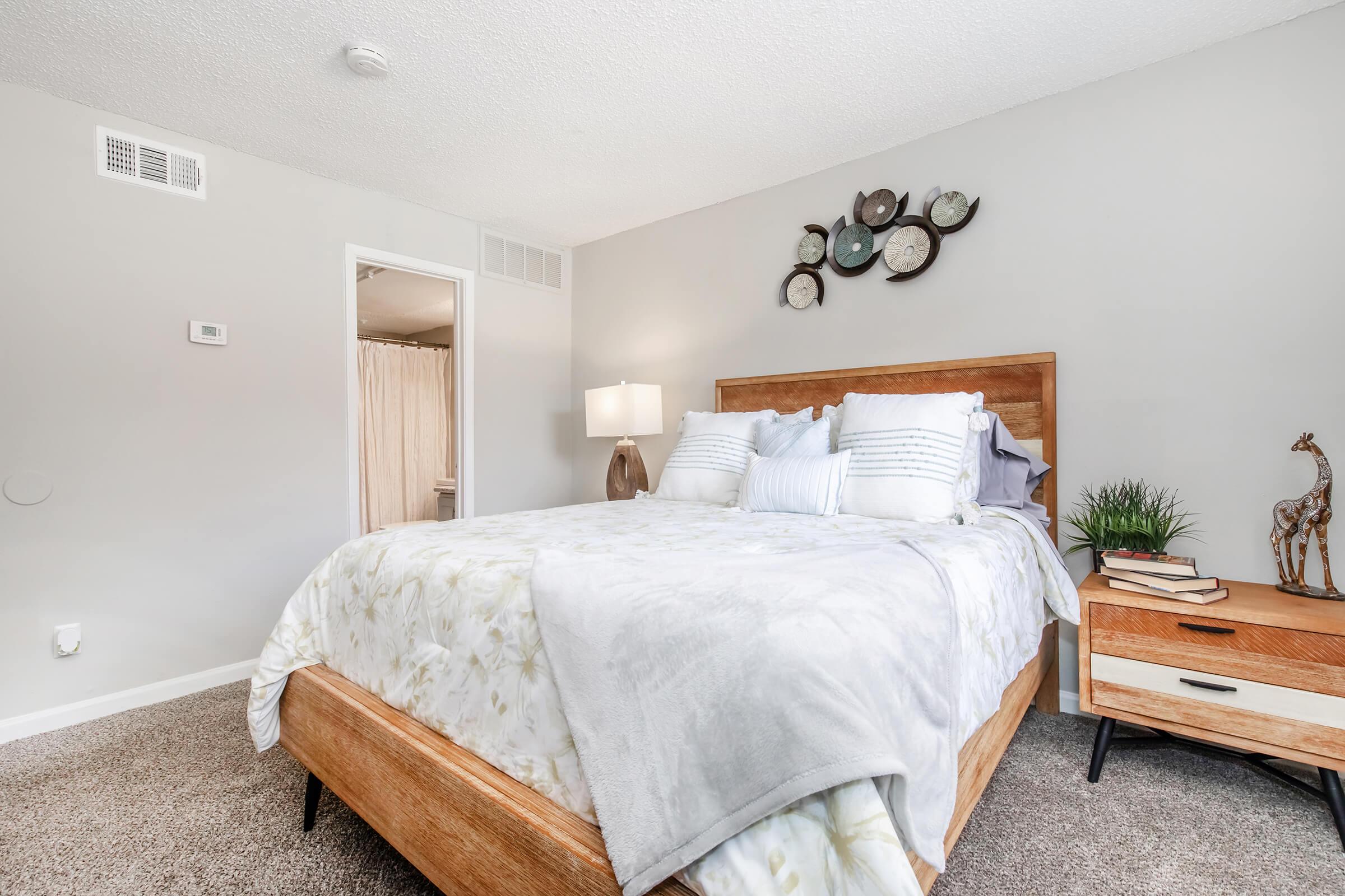 a bedroom with a large bed in a room