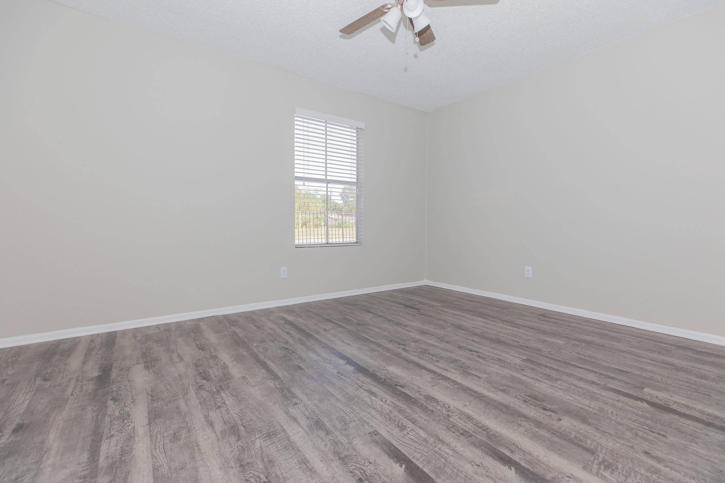 a bedroom with a large window