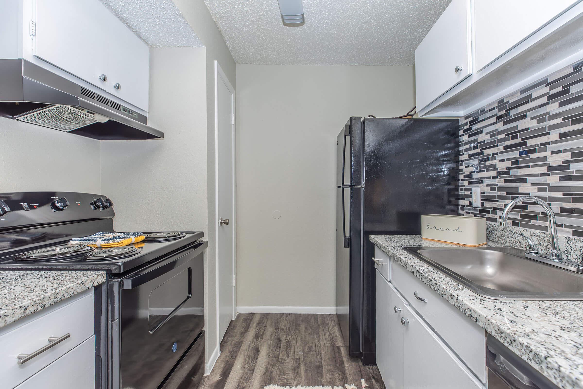 a stainless steel refrigerator in a kitchen