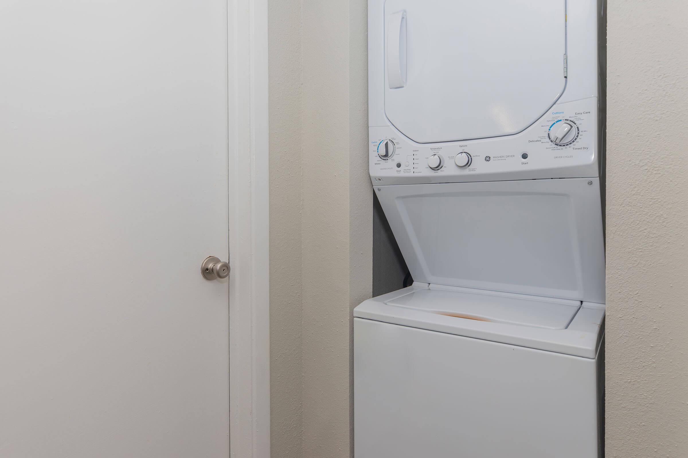 a refrigerator freezer sitting next to a door