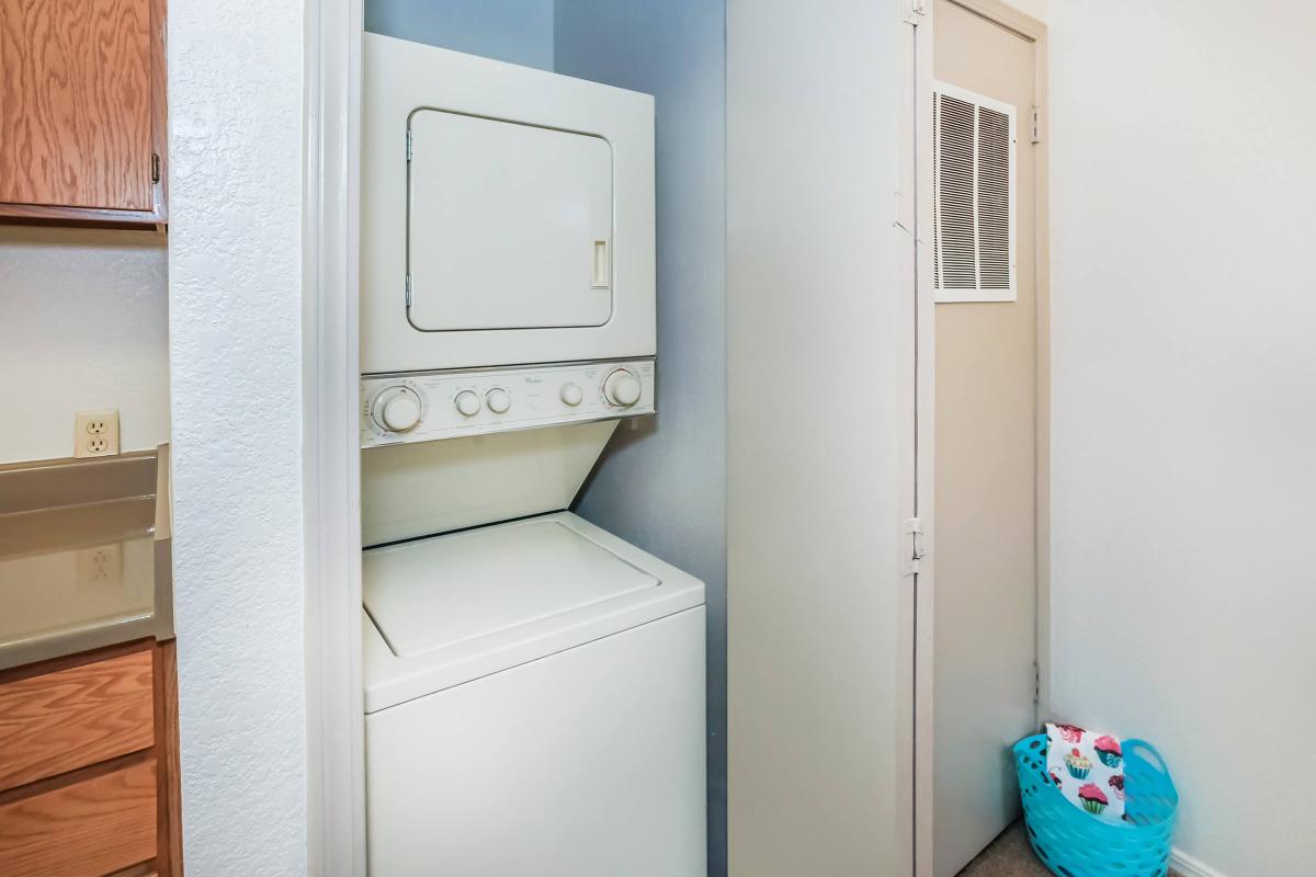 a white refrigerator freezer sitting inside of a kitchen