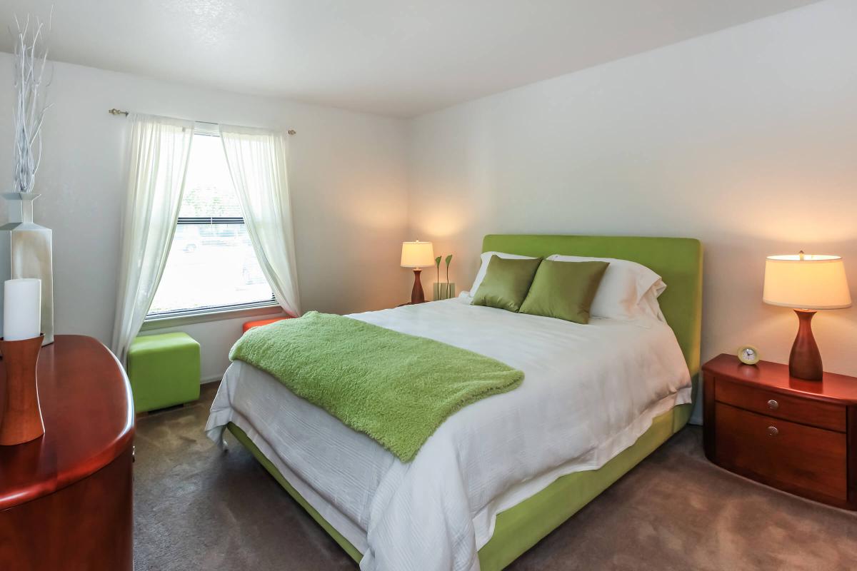 a bedroom with a large bed in a hotel room