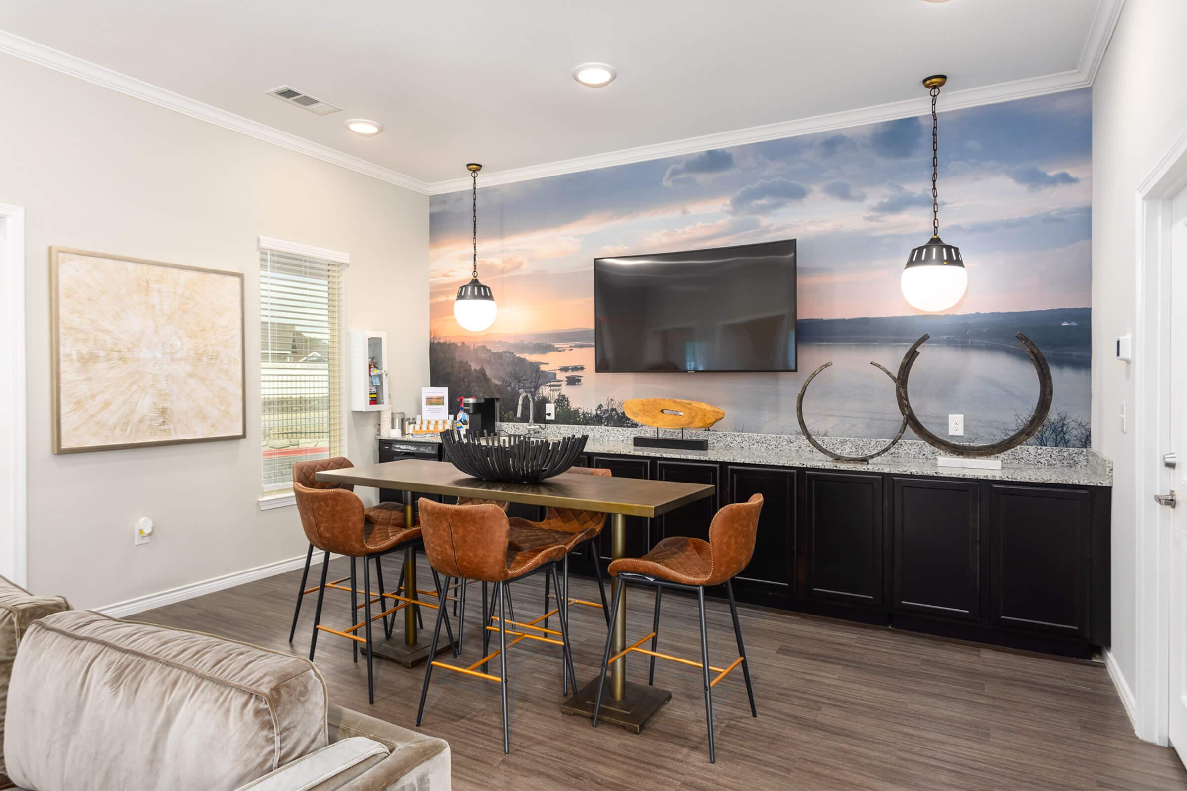 a living room filled with furniture and a flat screen tv