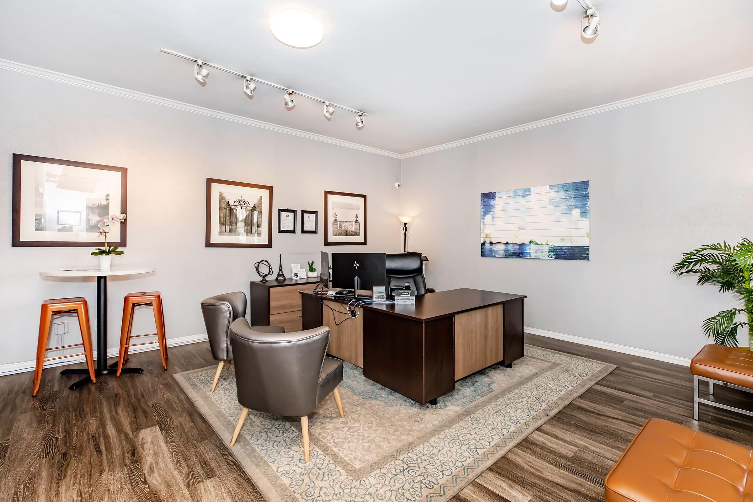 a living room filled with furniture and a flat screen tv