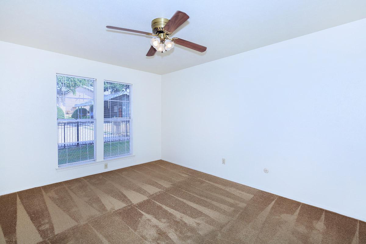 carpeted bedroom with a ceiling fan