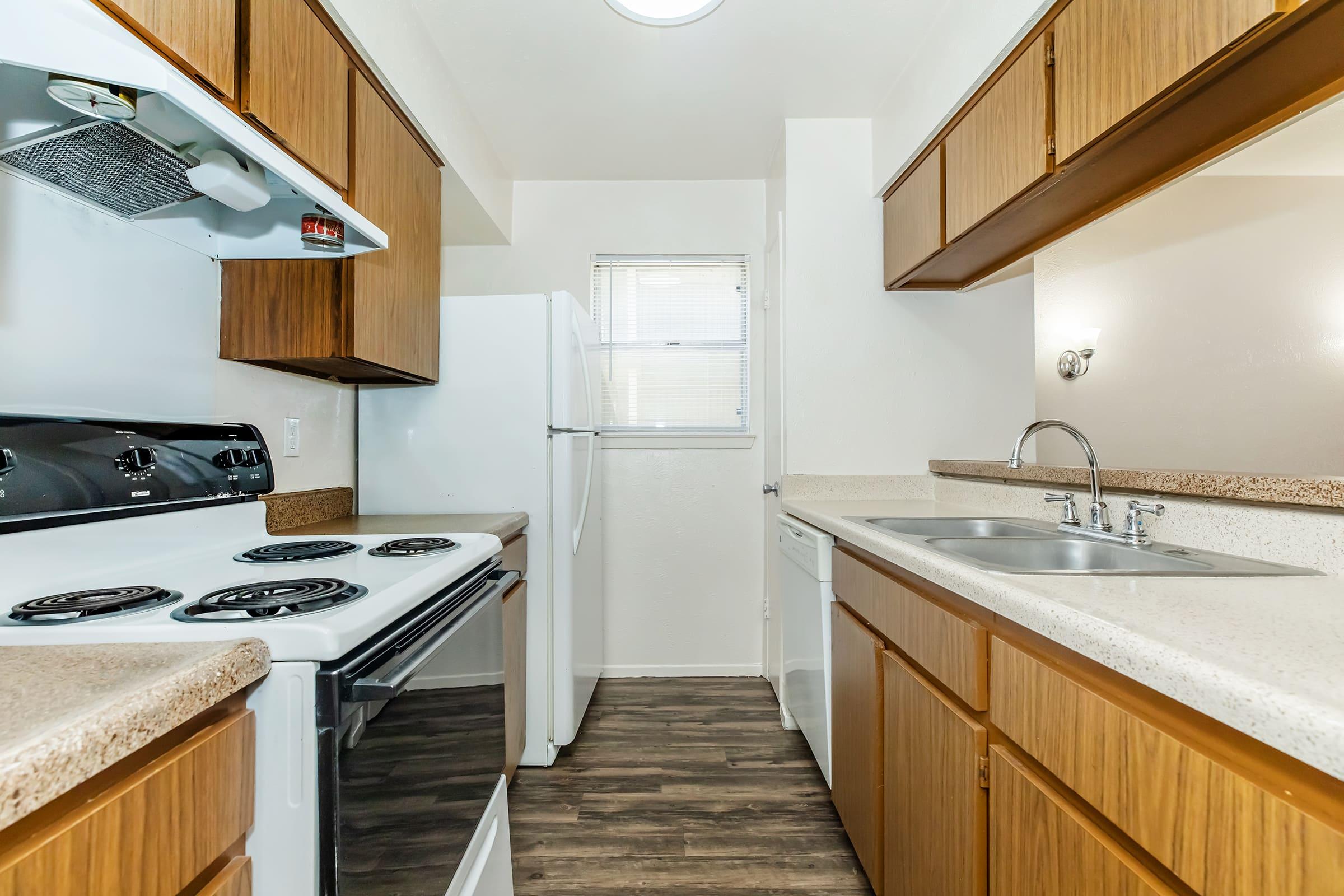 a kitchen with a stove and a sink