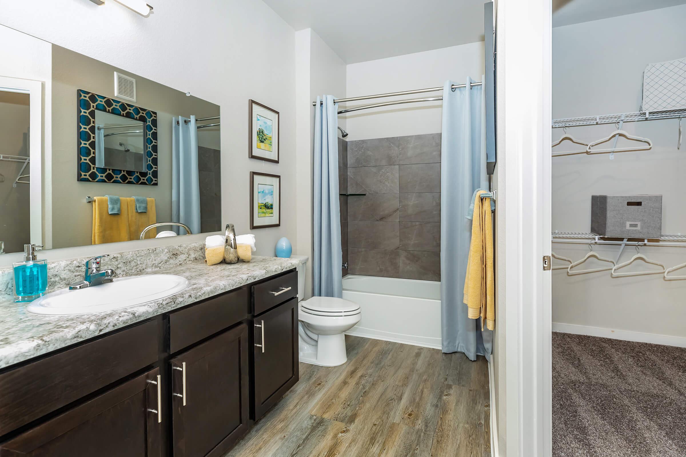 a kitchen with a sink and a mirror