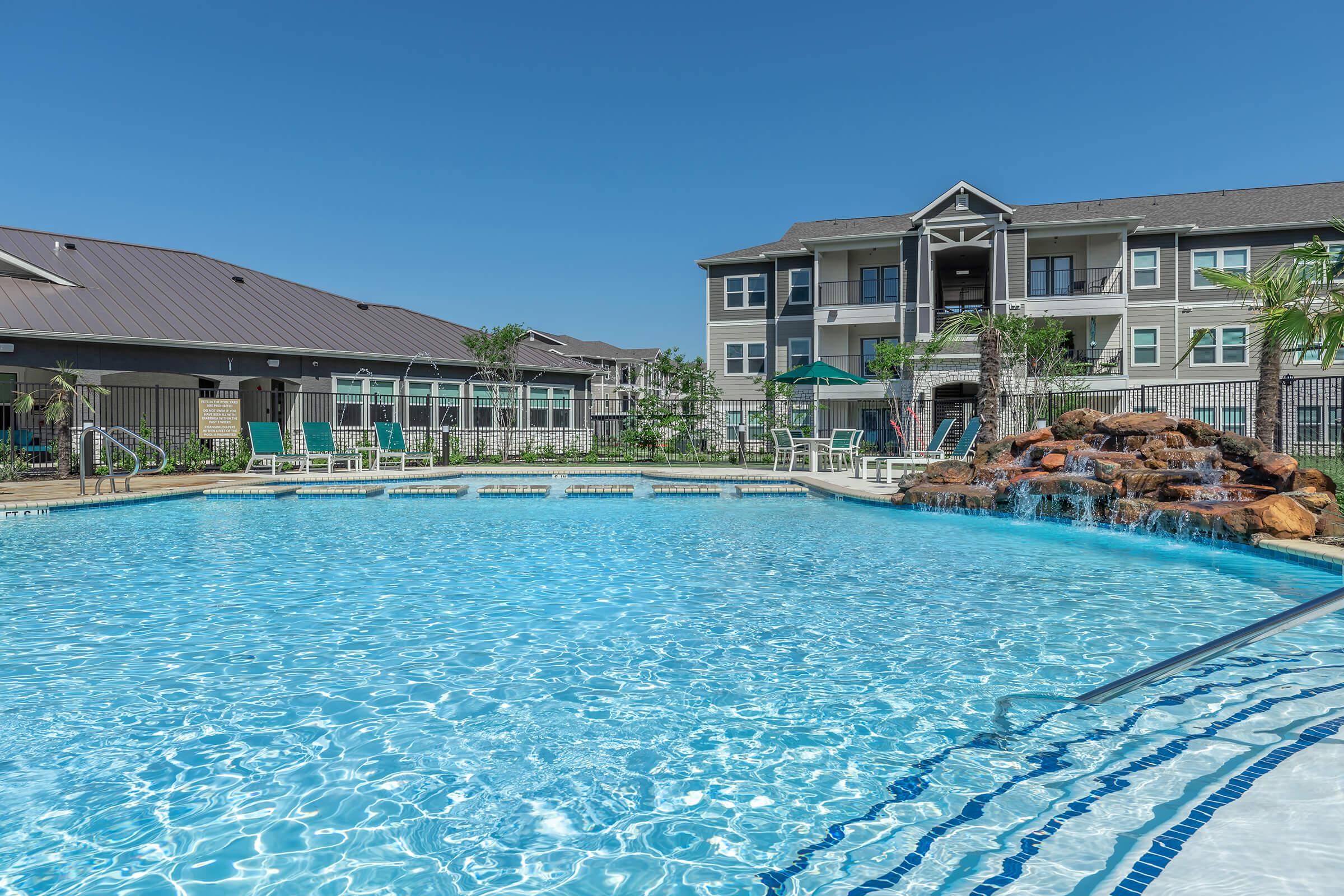 a house with a large pool of water