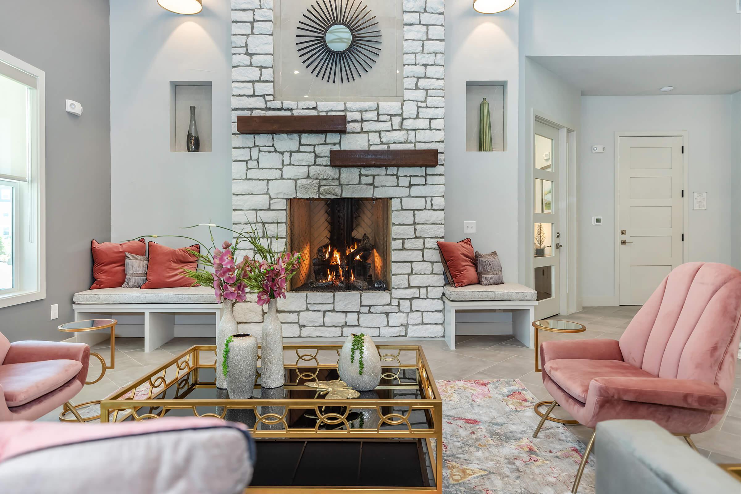 a living room filled with furniture and a fire place