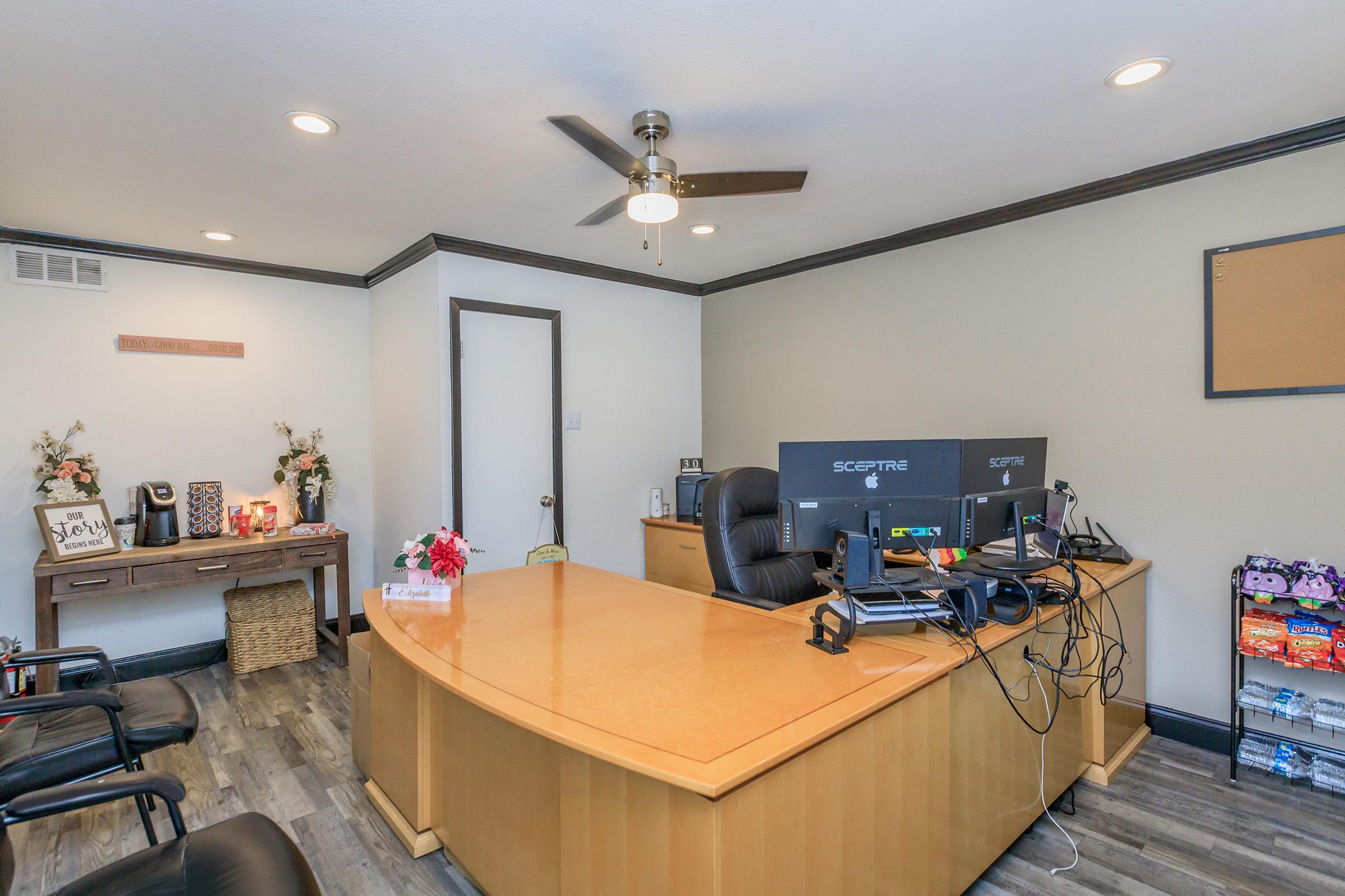 a living room filled with furniture and a flat screen tv