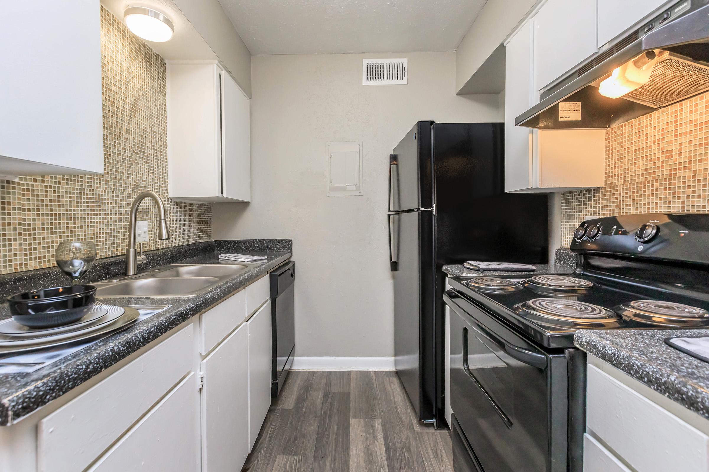 a modern kitchen with stainless steel appliances