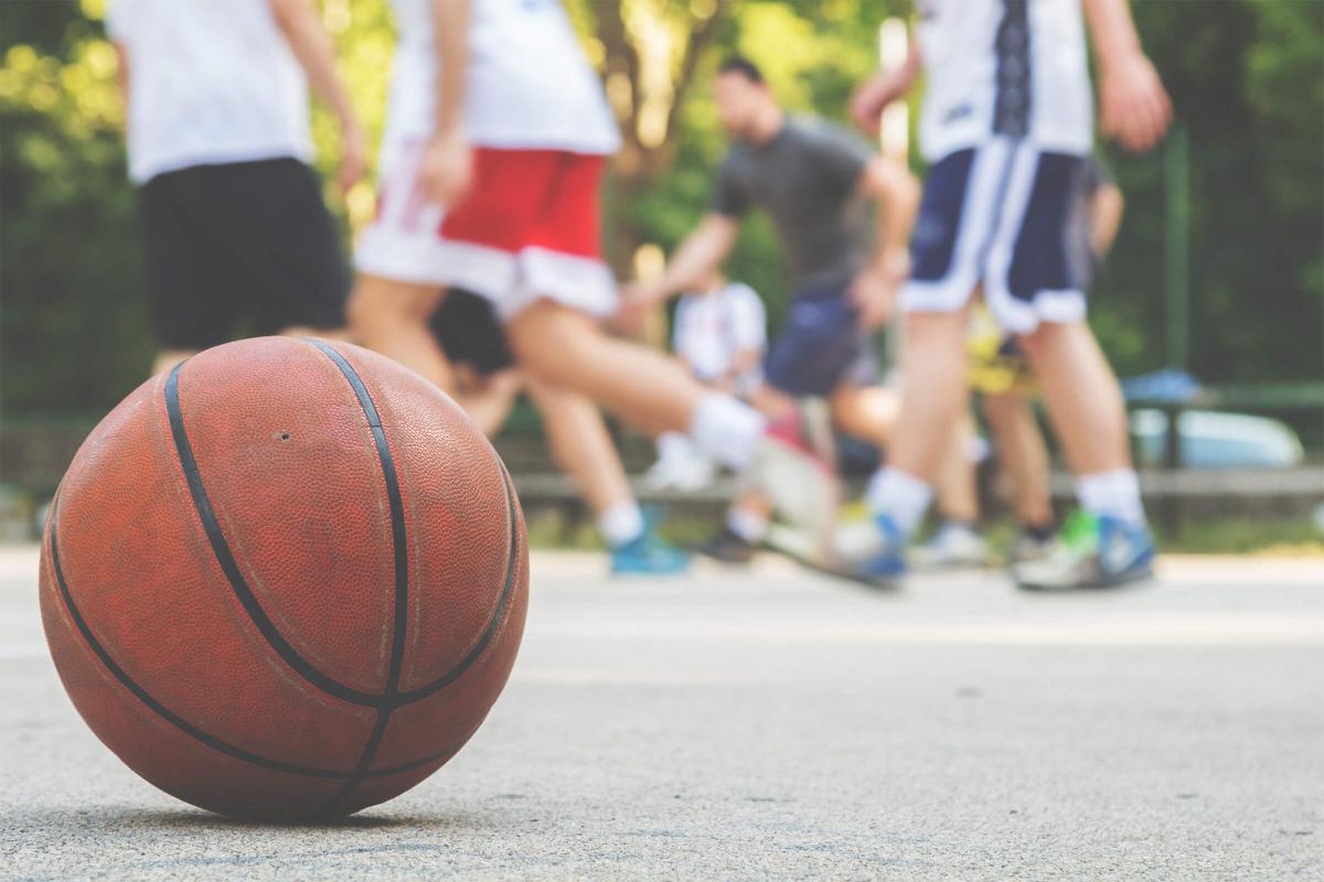 a person holding a basketball