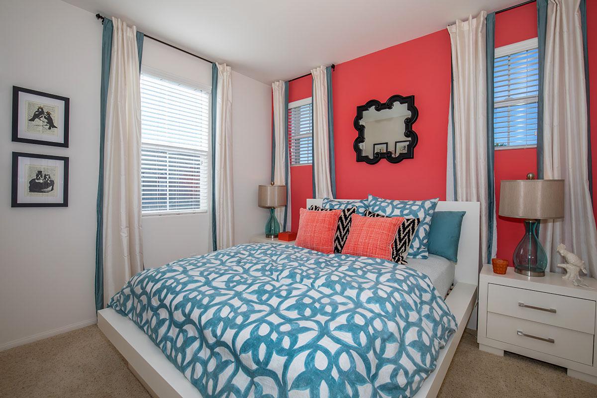 a bedroom with a bed in a room