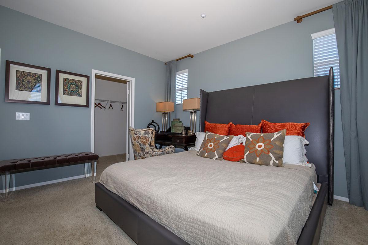 a bedroom with a large bed in a hotel room