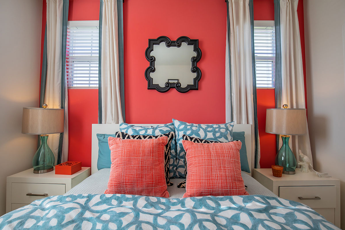 a bedroom with a bed in a room