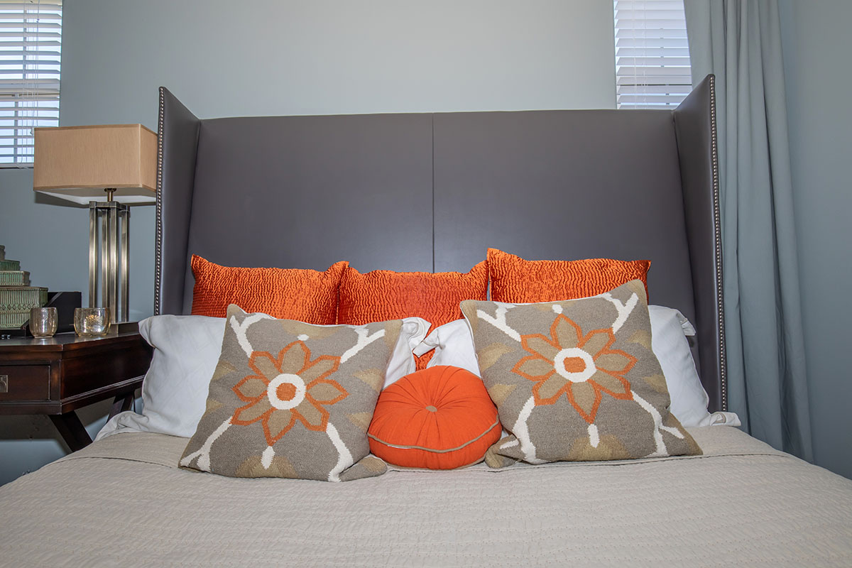a bedroom with a large bed sitting in a room