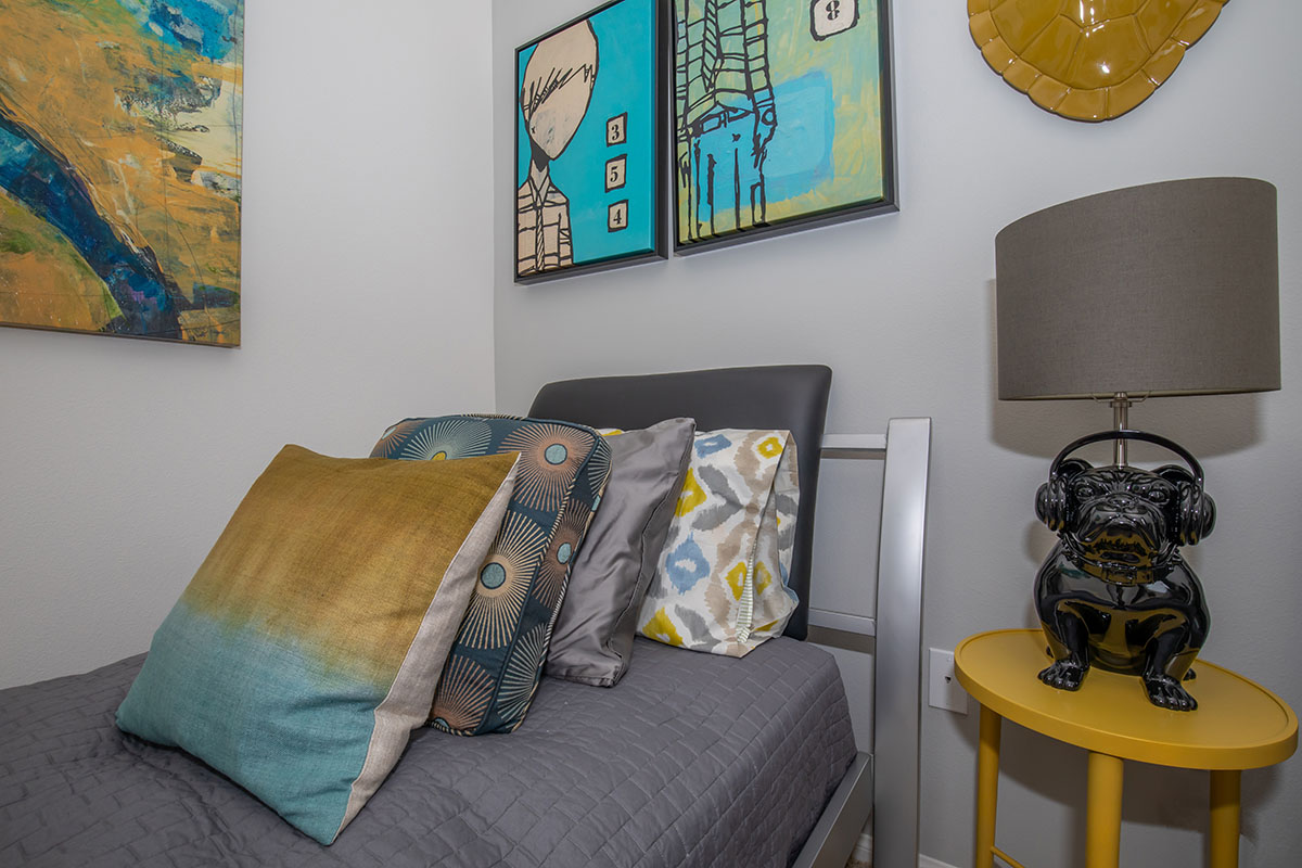 a yellow bed in a room