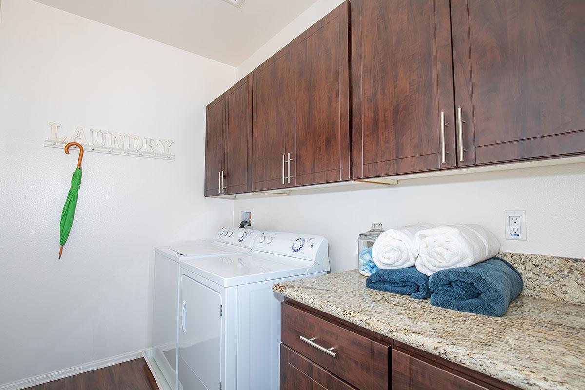 a kitchen with a sink and a refrigerator
