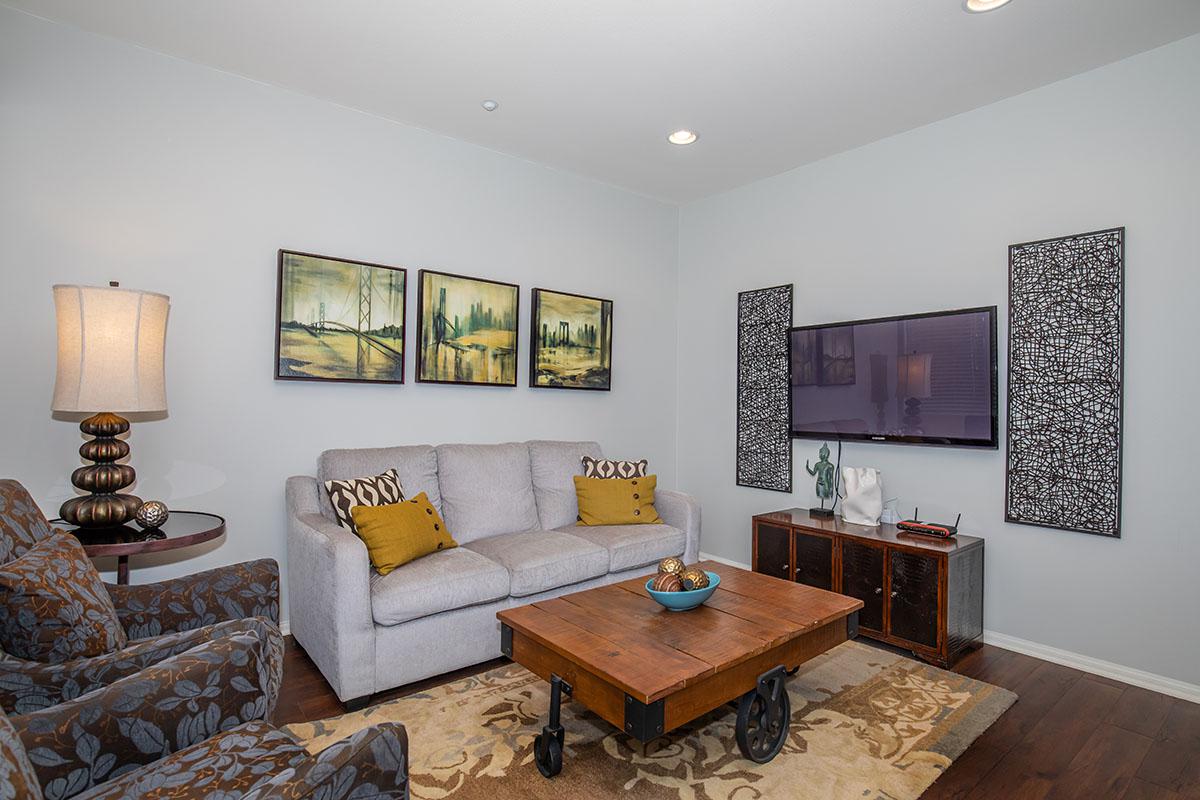 a living room filled with furniture and a fireplace