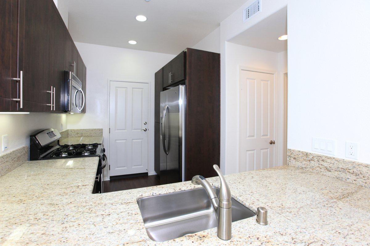 a modern kitchen with stainless steel appliances
