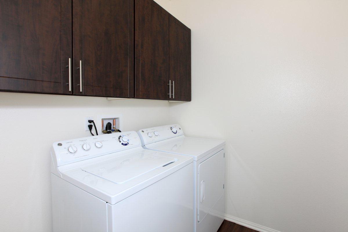 a white refrigerator freezer sitting inside of a kitchen
