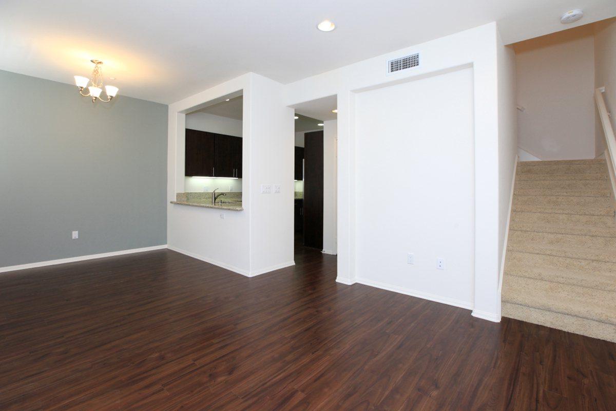 a large empty room with a wood floor