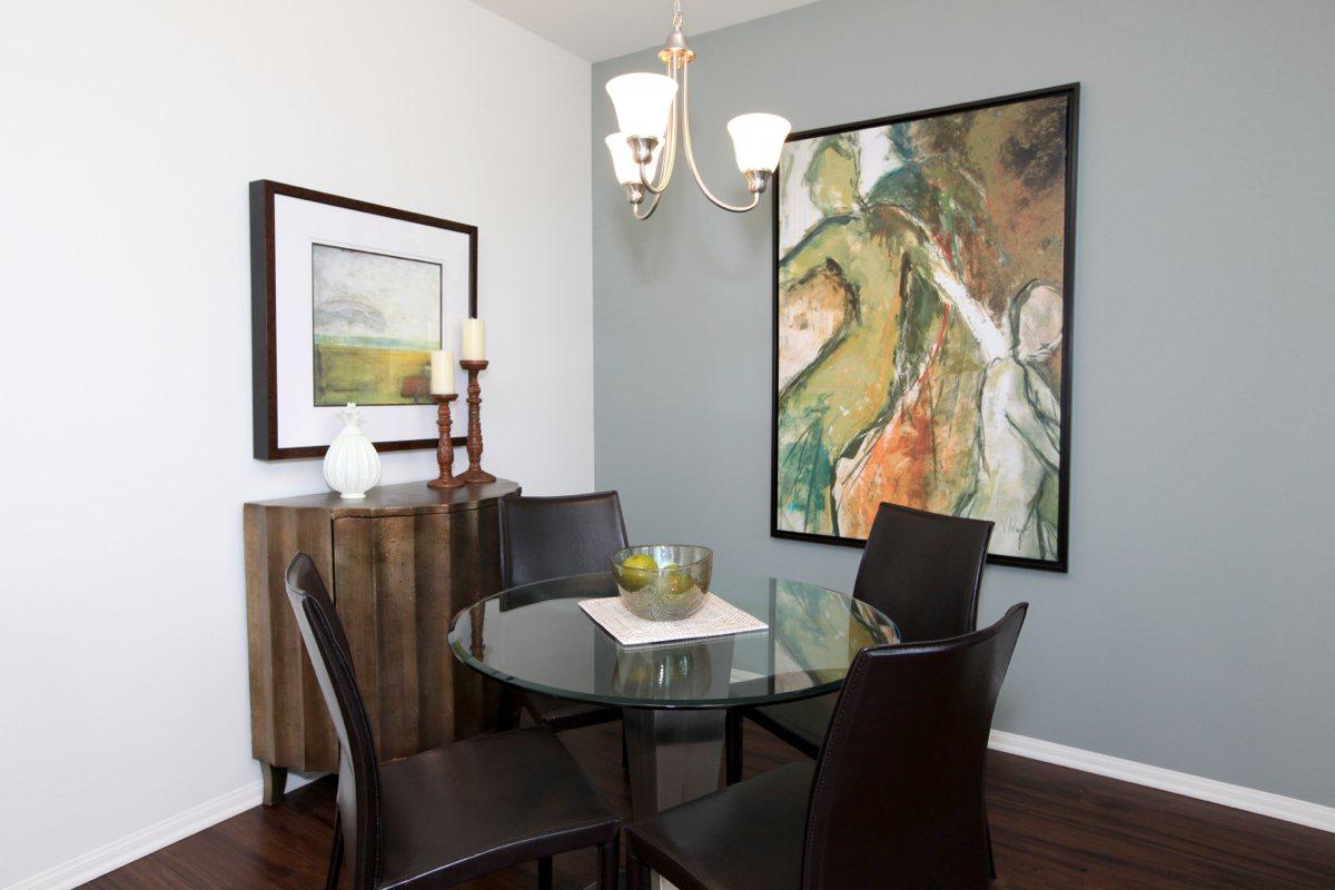 a bedroom with a desk and chair in a room