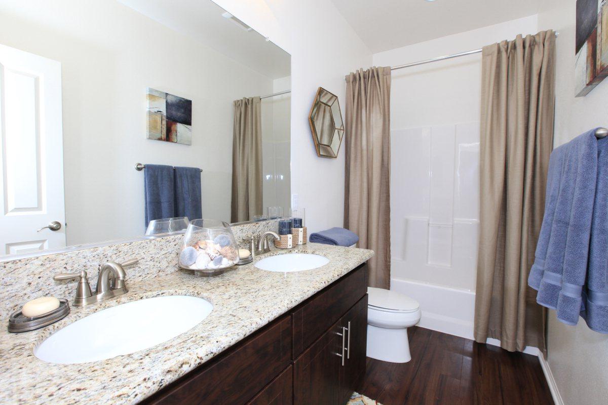 a room with a sink and a mirror