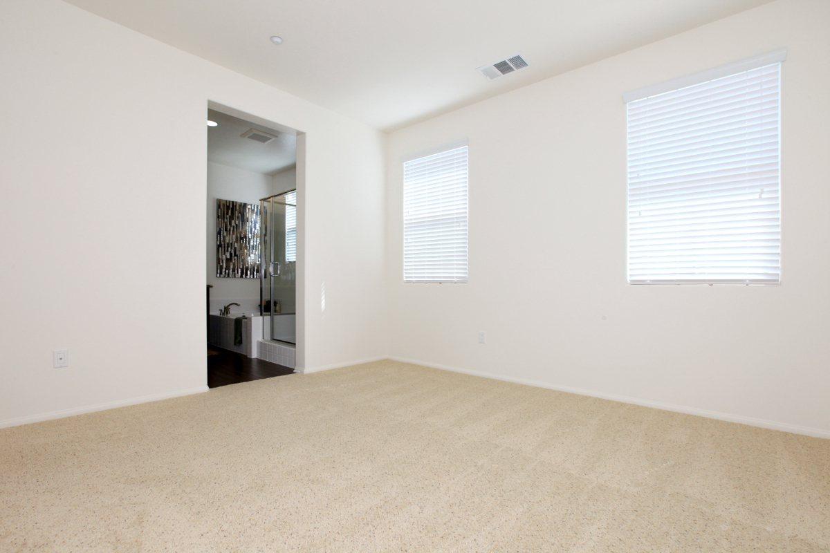a large white bed in a room