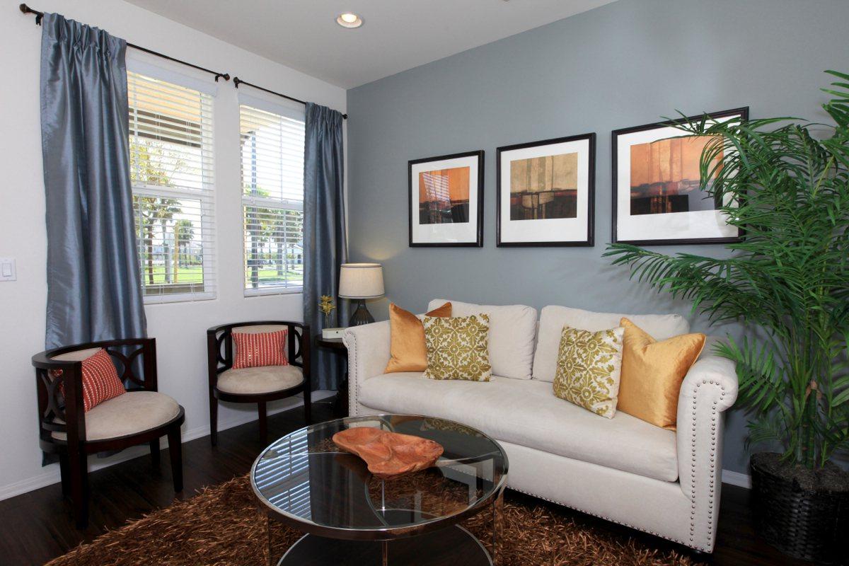 a living room filled with furniture and a fire place